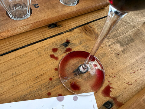 Spilled red wine on a wooden table
