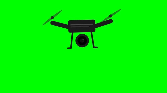 A black drone with a camera suspended in the air against a vibrant green screen background.