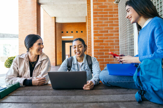 Diverse university students studying together on campus