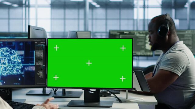 IT support workers code on green screen computers in AI data center while combining power management, hardware monitoring and server room operations.