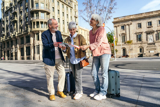 Senior travelers exploring city streets together