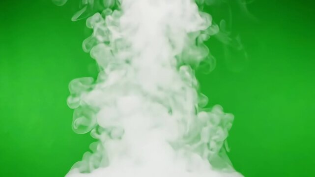 Hot white food steam and vapor swirling upwards against a bright green screen background for compositing