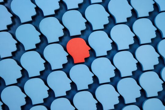 Red head among blue crowd symbols diversity individuality and standing out