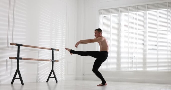 Professional dancer practicing moves in dance studio