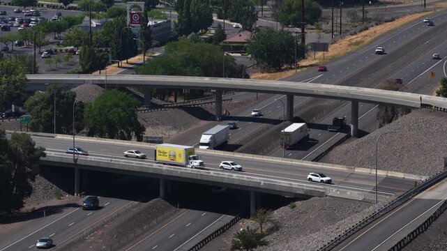 Aerial of multilane interstate 90 interchange and overpass in Yakima Washington summer day
