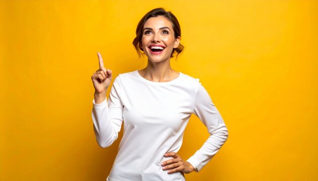 Confident young woman giving thumbs up in bright studio. Positive female professional approving success with cheerful smile and gesture.
