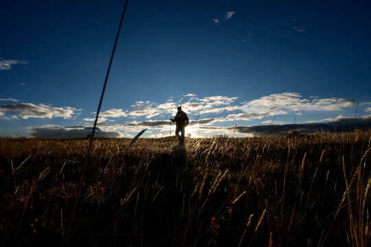 Lonely man in Andean paramo at sunset, Cotopaxi Ecuador