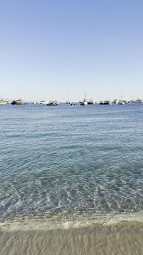     Scenic Coastal View of Ornos Beach with Crystal Clear Aegean Waters in Mykonos, Greece