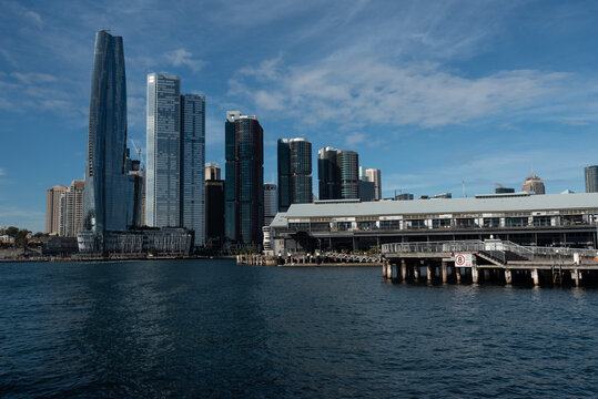 View of the entrance of Darling Harbour where it meets Sydney Harbour. The skyscrapers of Barangaroo in the background. Sydney, New South Wales, Australia.