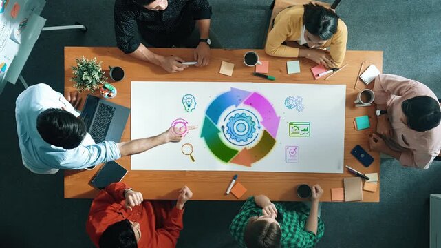 Collaborative Team Brainstorming Session with Colorful Visual Aids and Diverse Group of Professionals Engaging in Creative Discussion Sigmoid
