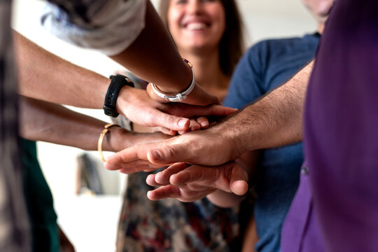 Team unity hands collaboration success