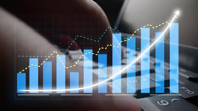This image captures hands typing on a keyboard, illustrating financial growth through dynamic charts and graphs, perfect for business and technology themes. Copula