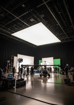Professional Film Studio Set with Camera Crane, Crew, and Large Overhead Lighting Rig for Movie Production