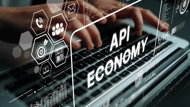 Hands Typing on Laptop Keyboard with Digital Icons Representing API Economy and Data Analysis Concepts in Technology Environment. Asymptotic smart data analytic.