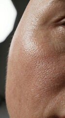 Fototapeta premium Close-up of Human Skin with Pores and Texture Detail.