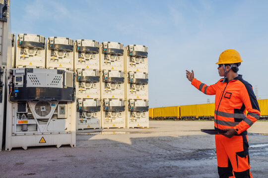 Industrial Engineer Inspecting Refrigerated Shipping Containers for Cold Chain Logistics and Temperature Control