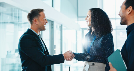 Business, partnership and people in agency with handshake, greeting and negotiation in b2b deal. Flare, introduction and happy employees with shaking hands, networking and agreement for collaboration © peopleimages.com