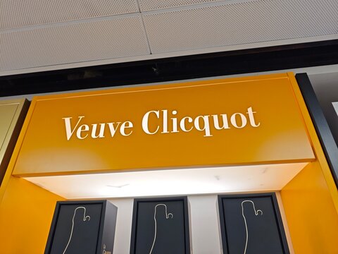 Stockholm, Sweden-Nov.28th 2025: Veuve Clicquot Champagne Yellow Store Sign and Brand Display