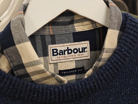 Stockholm, Sweden-Nov.28th 2025: Barbour brand logo on clothing label in store