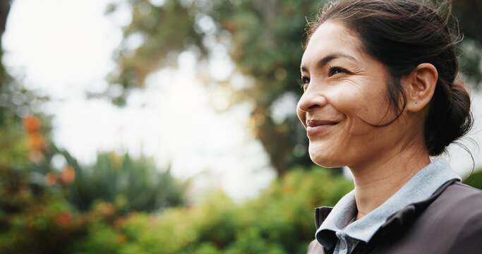 Business, smile and thinking with woman outdoor for fresh air, inspiration or planning. Future, idea and space with happy employee person in windy garden for development, opportunity or vision