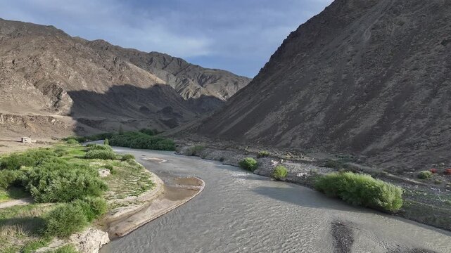 A picturesque landscape featuring the Chilik River in the mountains of the Almaty Region, southeastern Kazakhstan.	