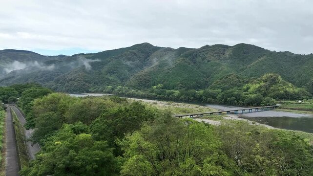 Aerial View of Sada Chinka Bridge over the Shimanto River on a Cloudy Early Summer Morning, Kochi, Japan