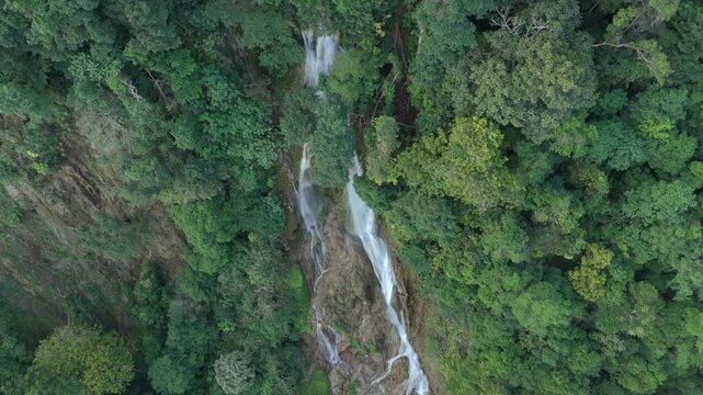 A beautiful waterfall, like a piece of heaven hidden in Sumba's interior, uniquely tiered as it flows down through rock formations like a natural staircase, standing about 90 meters tall