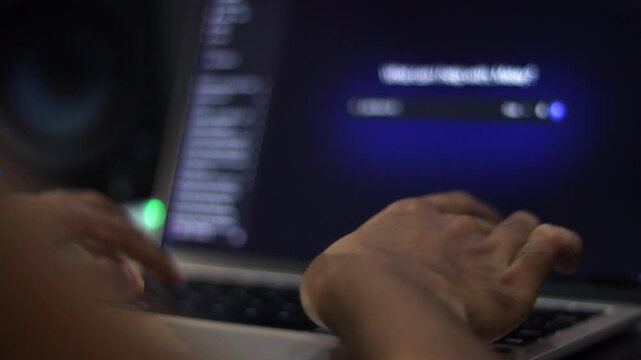 Person Using Laptop During Software Installation and Computer Setup