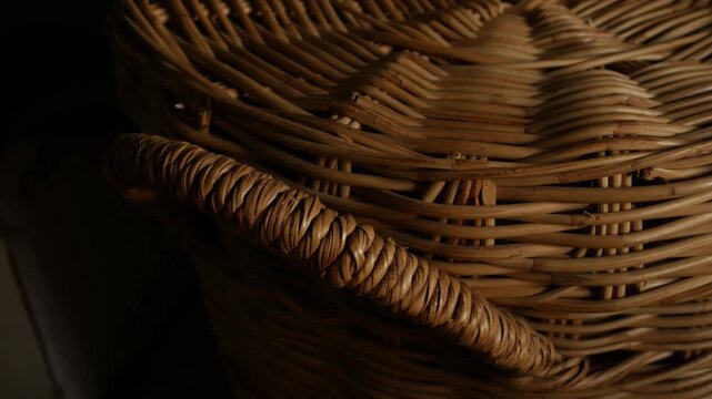 Woven Rattan Wicker Texture with Warm Sunlight, Close-Up Natural Basket Weave Pattern