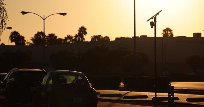 Fullerton, California, USA - July 23, 2026: An AI camera surveils a city street for car license plates.
