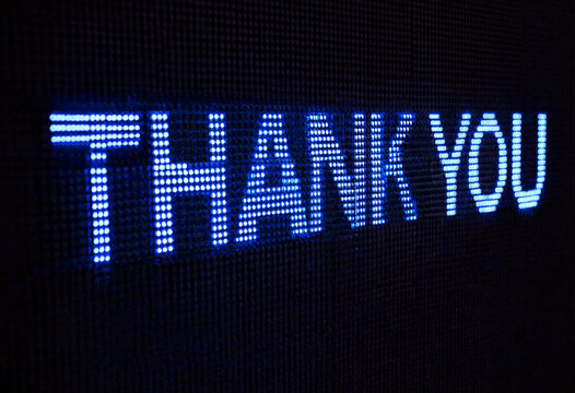 Glowing blue thank you sign displayed on digital led screen for appreciation messages