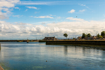 Fototapeta premium Irish harbor waterfront with quay and calm water