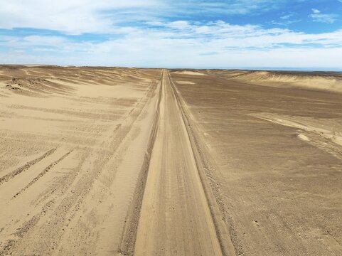 Desert road in the Namib Desert. Aerial view. Drone shot. Skeleton Coast, Namibia