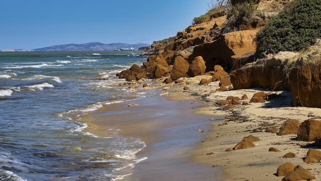 Vulcanic Beach, natural rocky coast with sea and waves, blue sky in the background, Kos, Dodecanese, Greek Islands, Greece