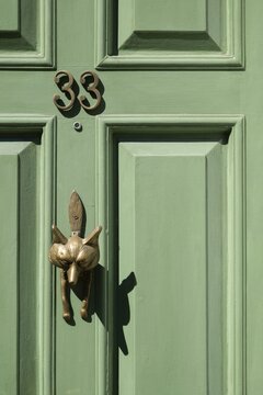 Light green, coffered door with fox shaped brass door knocker and house number 33, Chelsea, London, Great Britain, England, Great Britain