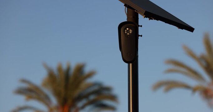 Fullerton, California, USA - July 23, 2026: An AI camera surveils a city street for car license plates.