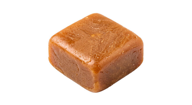A single piece of chewy caramel candy isolated on a white background