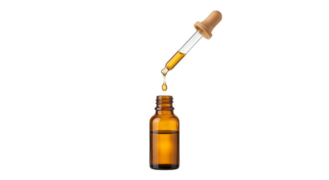 Amber glass dropper bottle with golden liquid dripping into it