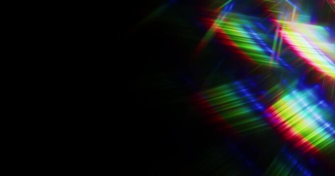 Lights shining into a prism causing an optical effect of a brilliant rainbow of dancing light rays. Light reflect creating a visual of a dreamy burst of light shining and sparkling. Seamless Loop.