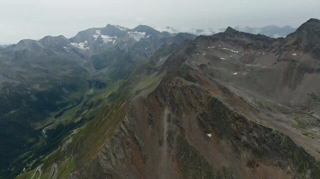 Scenic aerial landscape of the Timmelsjoch mountain pass between Italy and Austria with majestic alpine peaks dramatic valleys and unforgettable travel