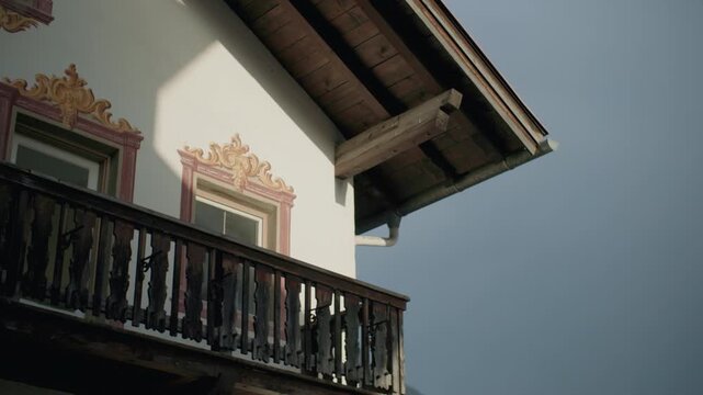 Picturesque alpine village architecture in Umhausen Austria with traditional painted houses surrounded by beautiful mountain scenery