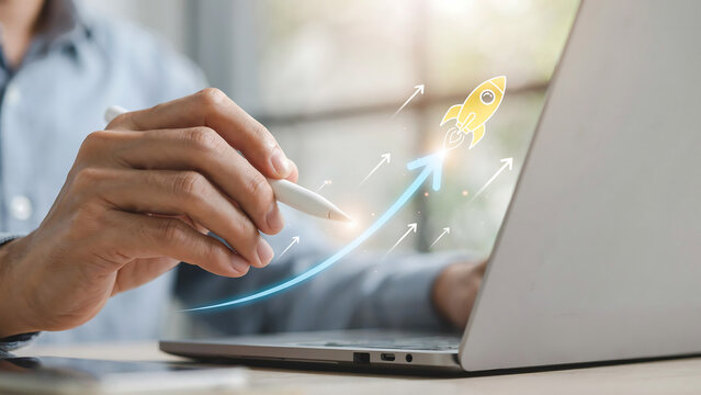 Close up of person using laptop with digital rocket growth icon business strategy development marketing progress analysis technology planning opportunity management innovation performance