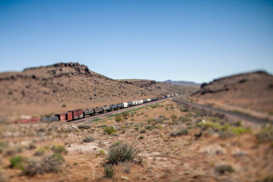 Freight train looks like a toy in the desert