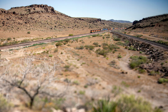 Miniature tilt shift view of train in desert canyon