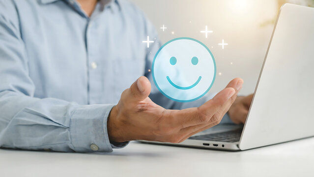 Professional using laptop displaying glowing customer satisfaction smiley face feedback icon with satisfaction feedback customer business experience positive evaluation interface hologram
