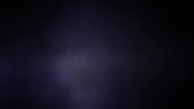 Dark atmospheric smoke and moody fog background video. Slow motion swirling purple and blue vapor in low light. Cinematic abstract footage for mystery, horror, or title sequence backdrops.