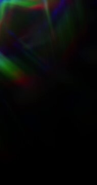 Lights shining into a prism causing an optical effect of a brilliant rainbow of dancing light rays. Light reflect creating a visual of a dreamy burst of light shining and sparkling. Seamless Loop.