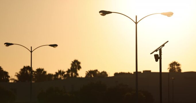 Fullerton, California, USA - July 23, 2026: An AI camera surveils a city street for car license plates.