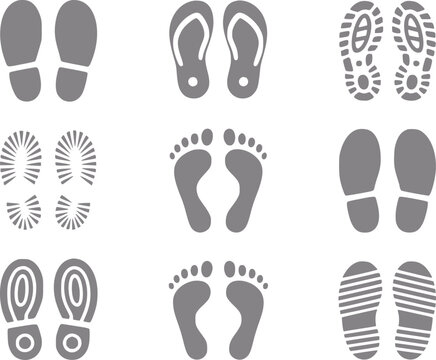Una colecci&oacute;n de varias huellas grises y suelas de zapatos aisladas sobre un fondo blanco para proyectos