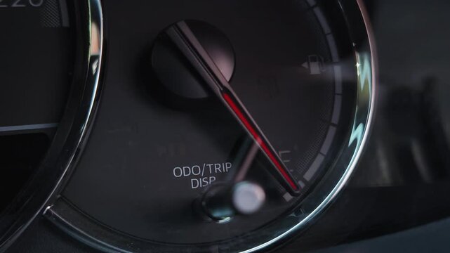 Close up of car dashboard showing illuminated door lock security warning indicator